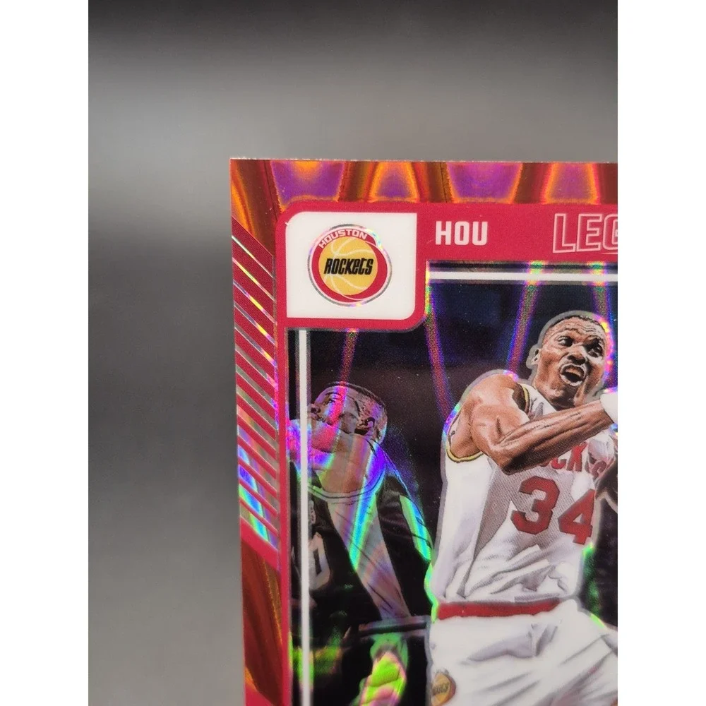 2024-25 Panini Optic Hakeem Olajuwon #249 Legends Red Seismic Prizm /149 Rockets